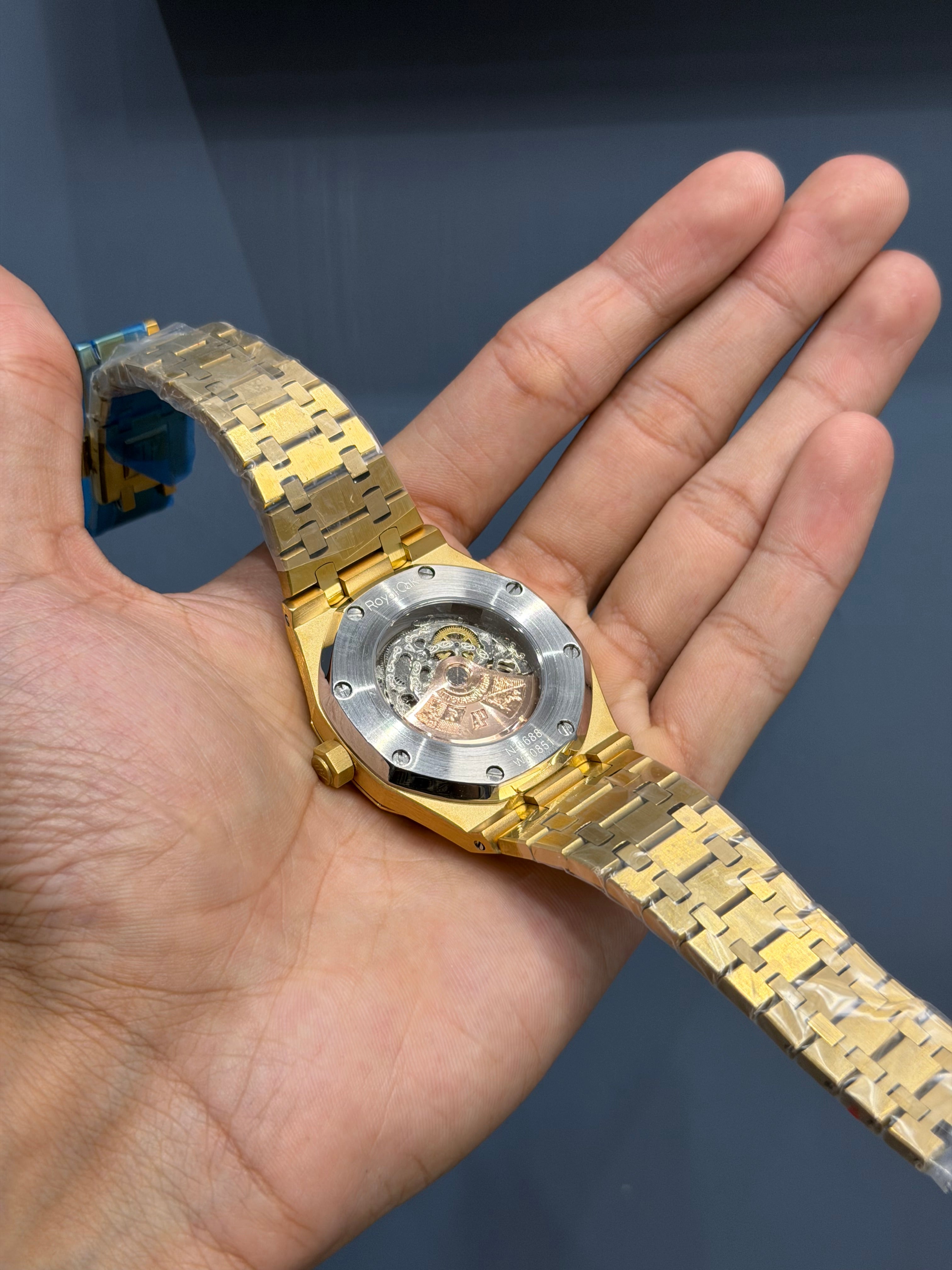 NEW COLLECTION YELLOW GOLD WITH BLUE SKELETON DIAL & RAINBOW STONE BEZEL
