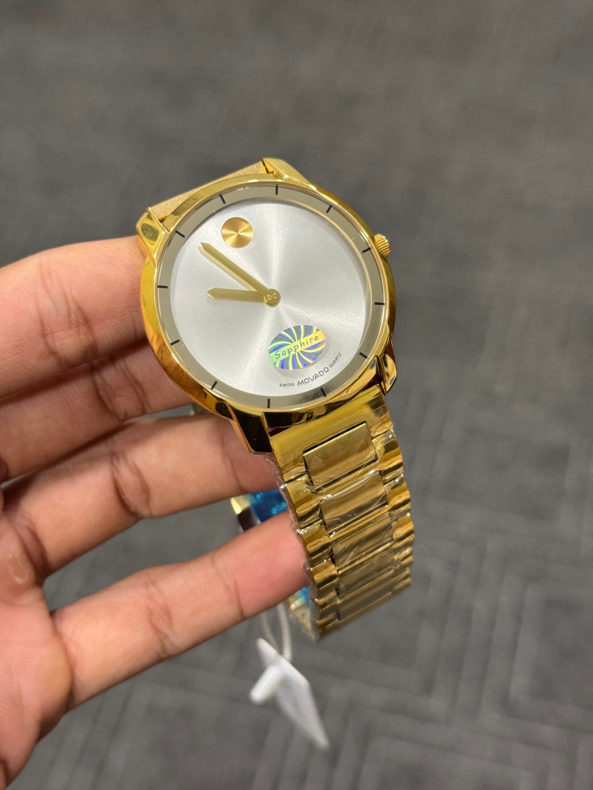 Movado | Gold Chain | White Dial