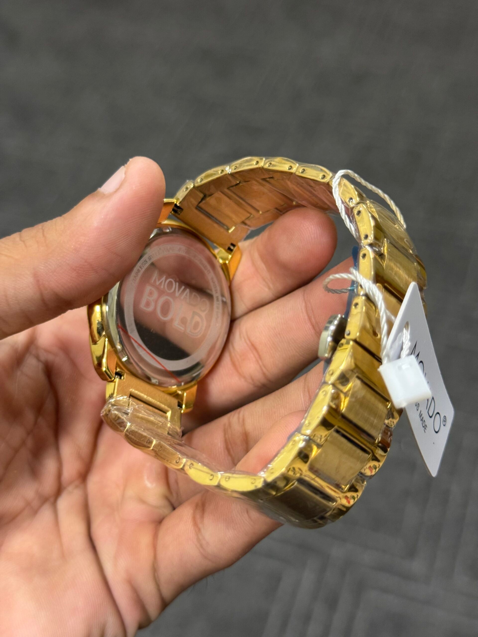 Movado | Gold Chain | White Dial